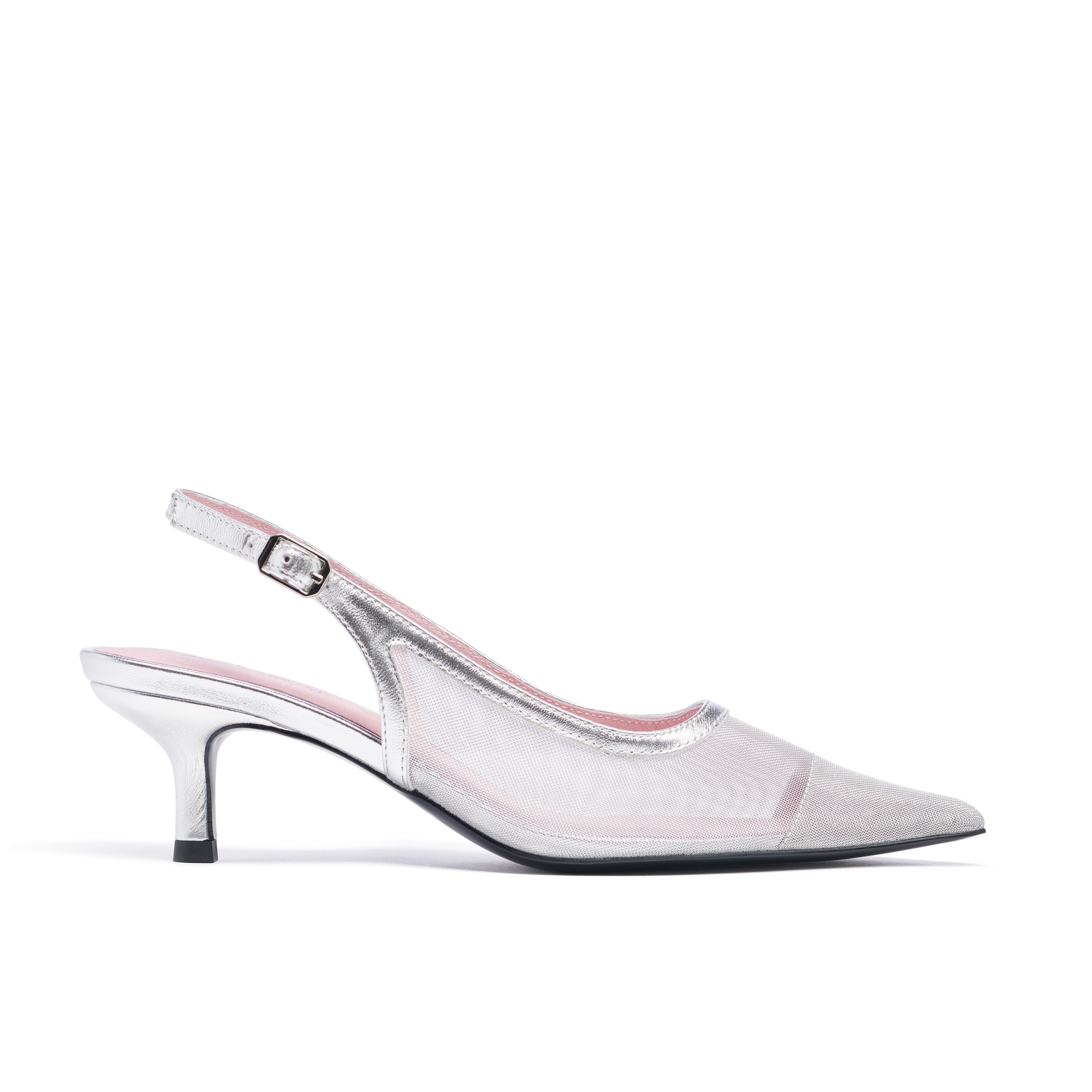 Clear slingback high heel shoe on a white background. Tinsel