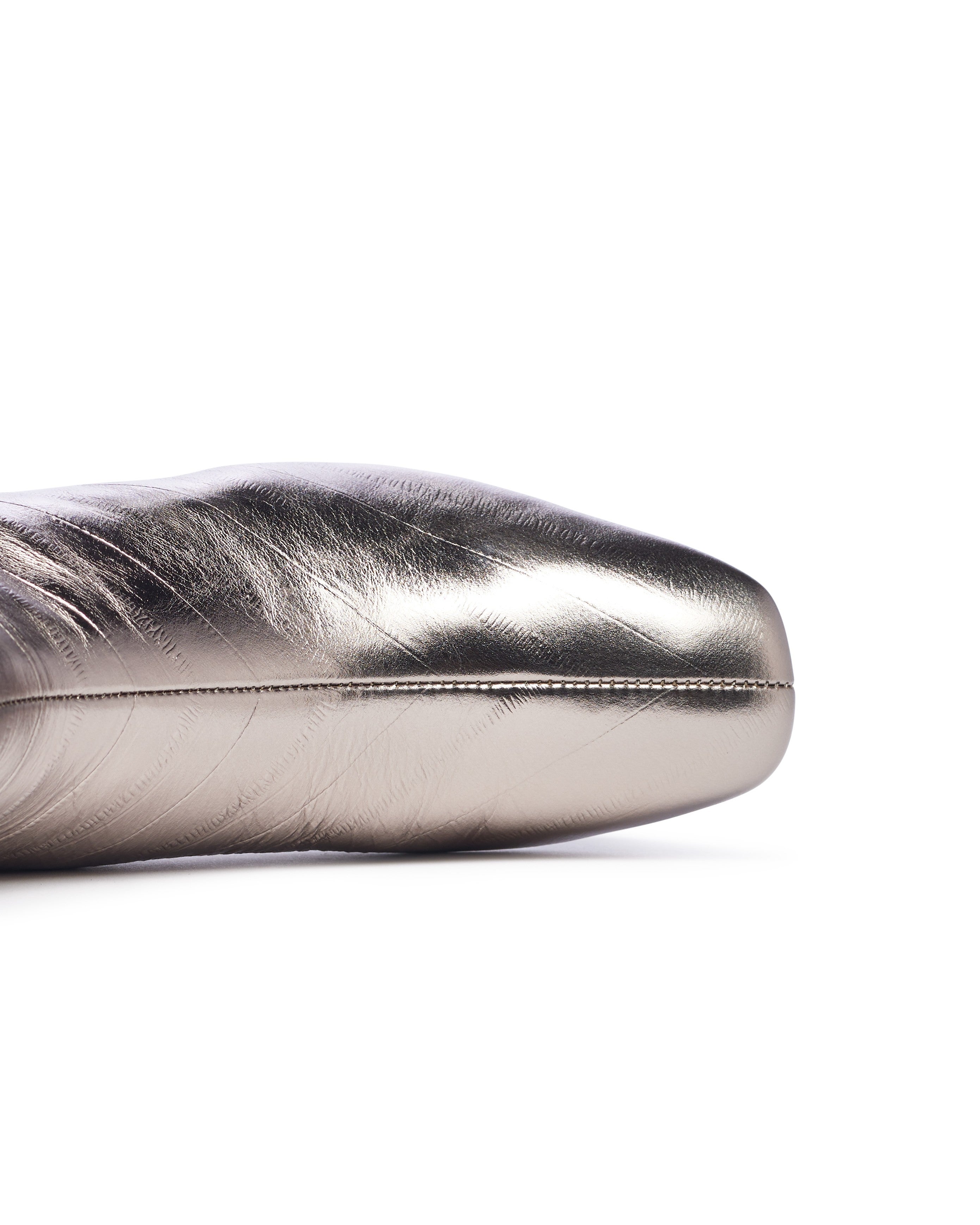 Silver metallic shoe on a white background