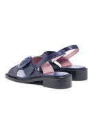 Navy blue sandals with a platform sole on a white background