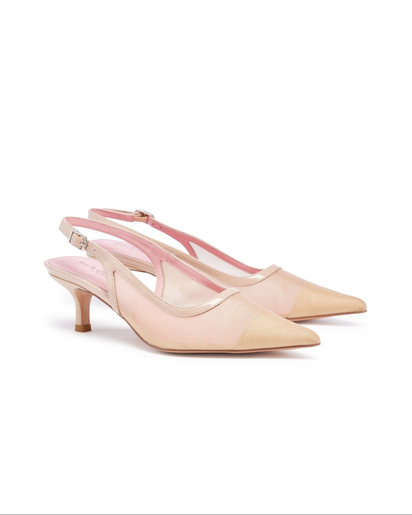 Pair of beige high-heeled shoes on a white background. Nude