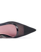 Black pointed-toe shoe with pink interior on a white background. Black