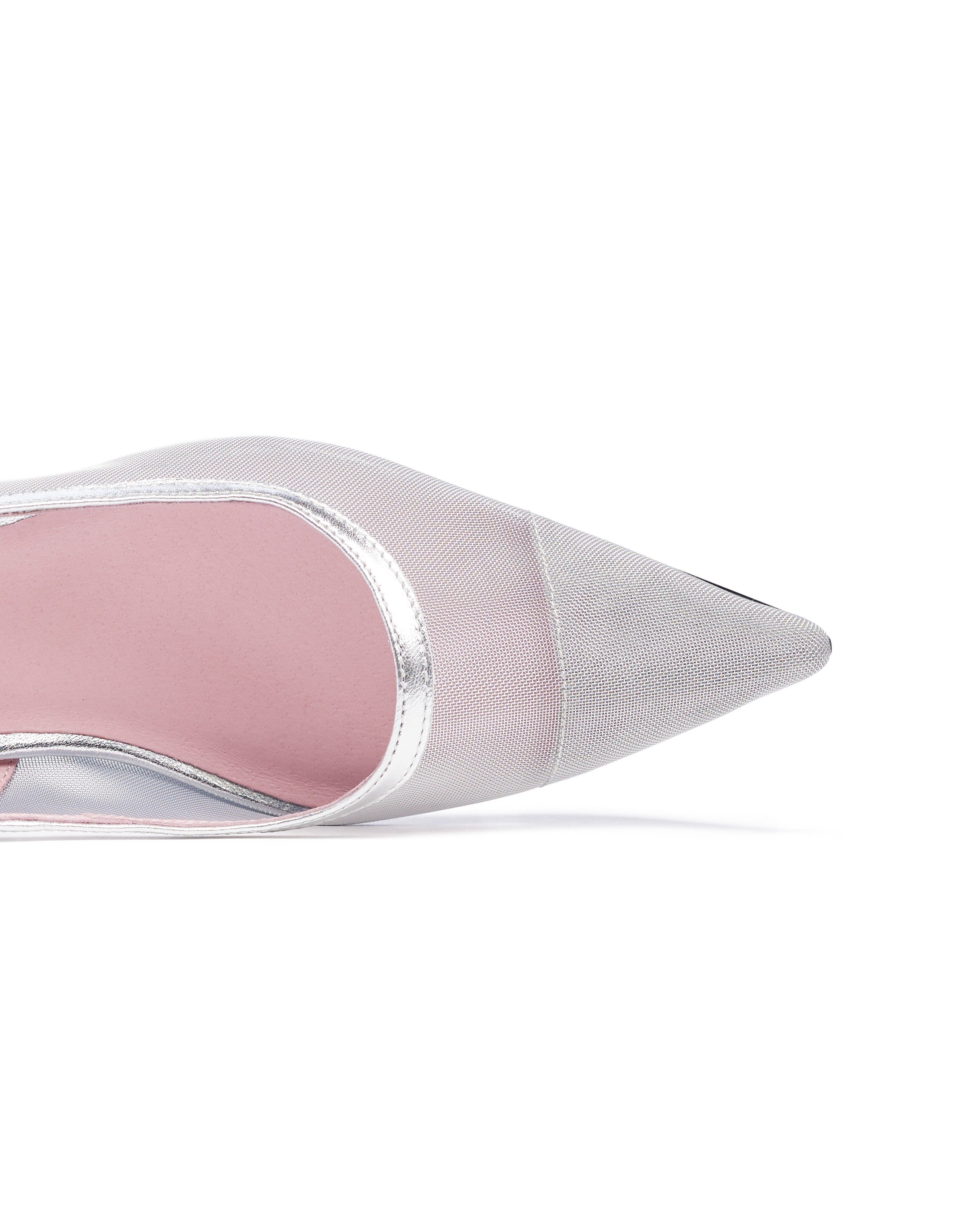 White pointed-toe shoe with pink interior on a white background. Tinsel