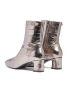 Metallic silver ankle boots with a block heel on a white background